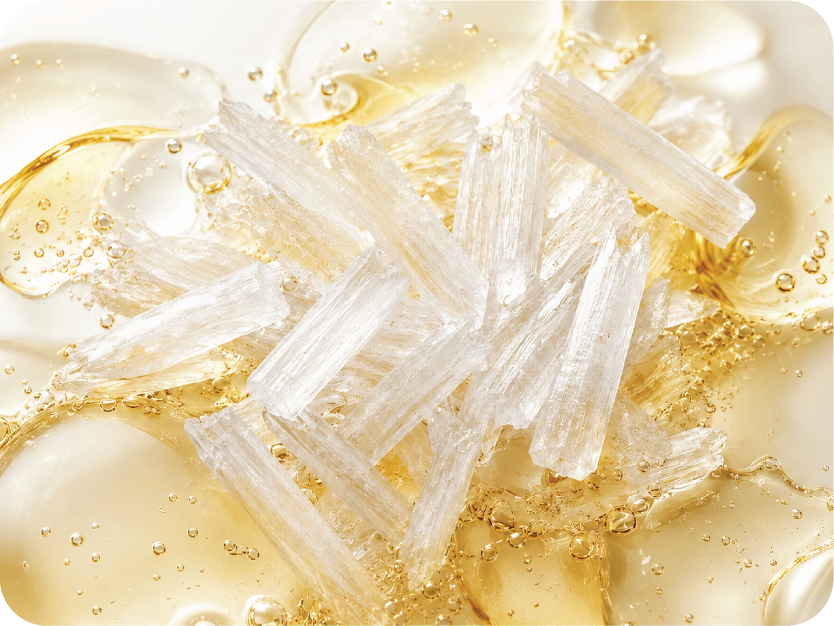 Close-up of crystal-like structures in a liquid with bubbles
