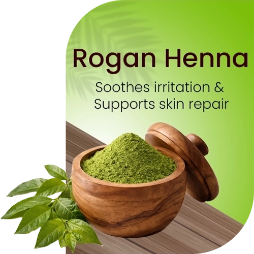 Wooden bowl with green powder labeled 'Rogan Henna' on a light green background